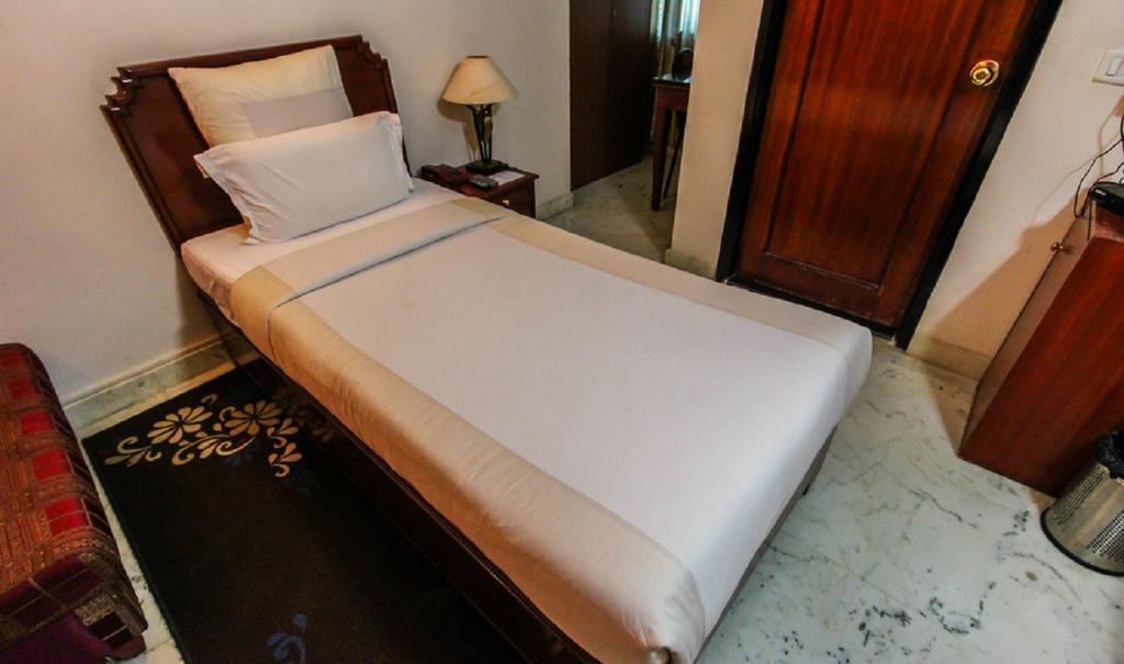 Hotel Pigeon International Bangalore Habitación foto