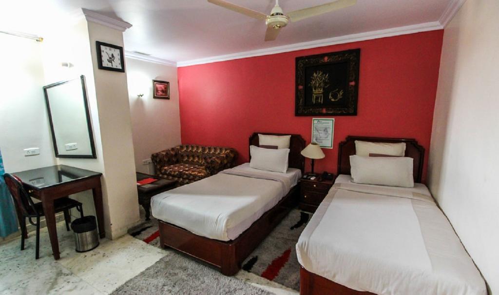 Hotel Pigeon International Bangalore Habitación foto